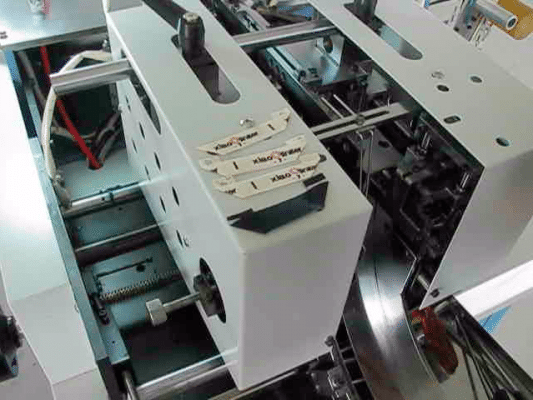 garment label cutting and folding machine mitre fold problem improvement